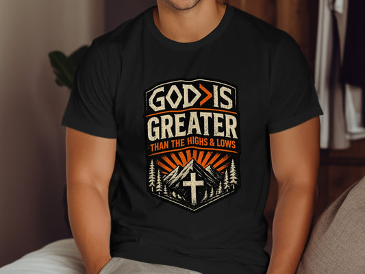 Black t-shirt with "God is greater than the highs and lows" text and mountain graphic.