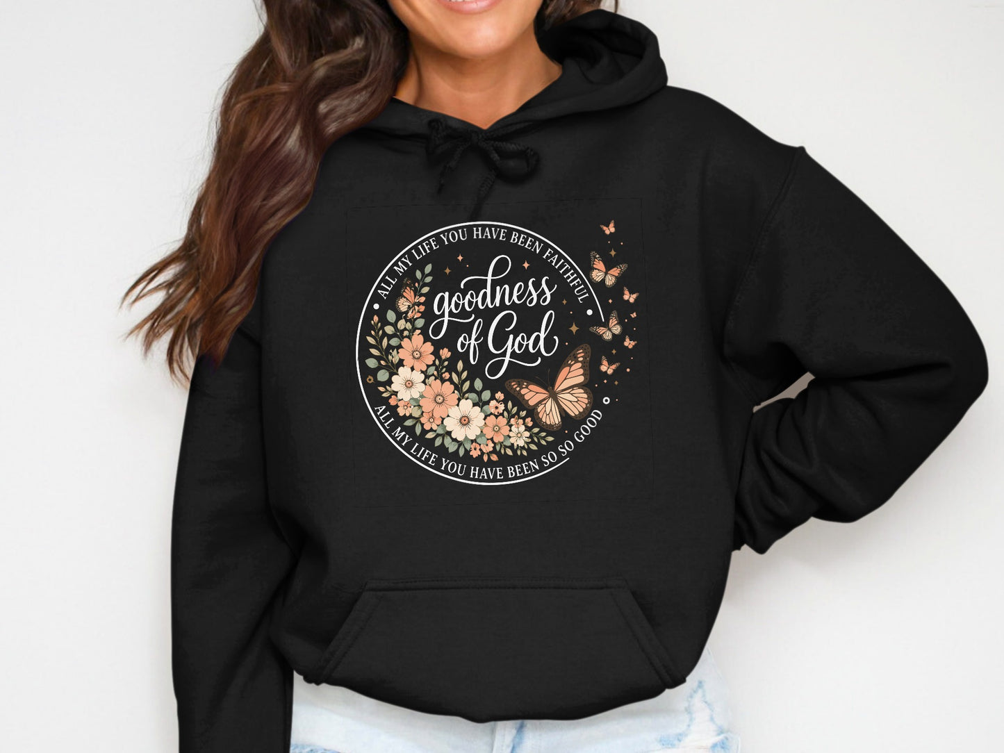 Black hoodie with floral graphic and "goodness of God" text.