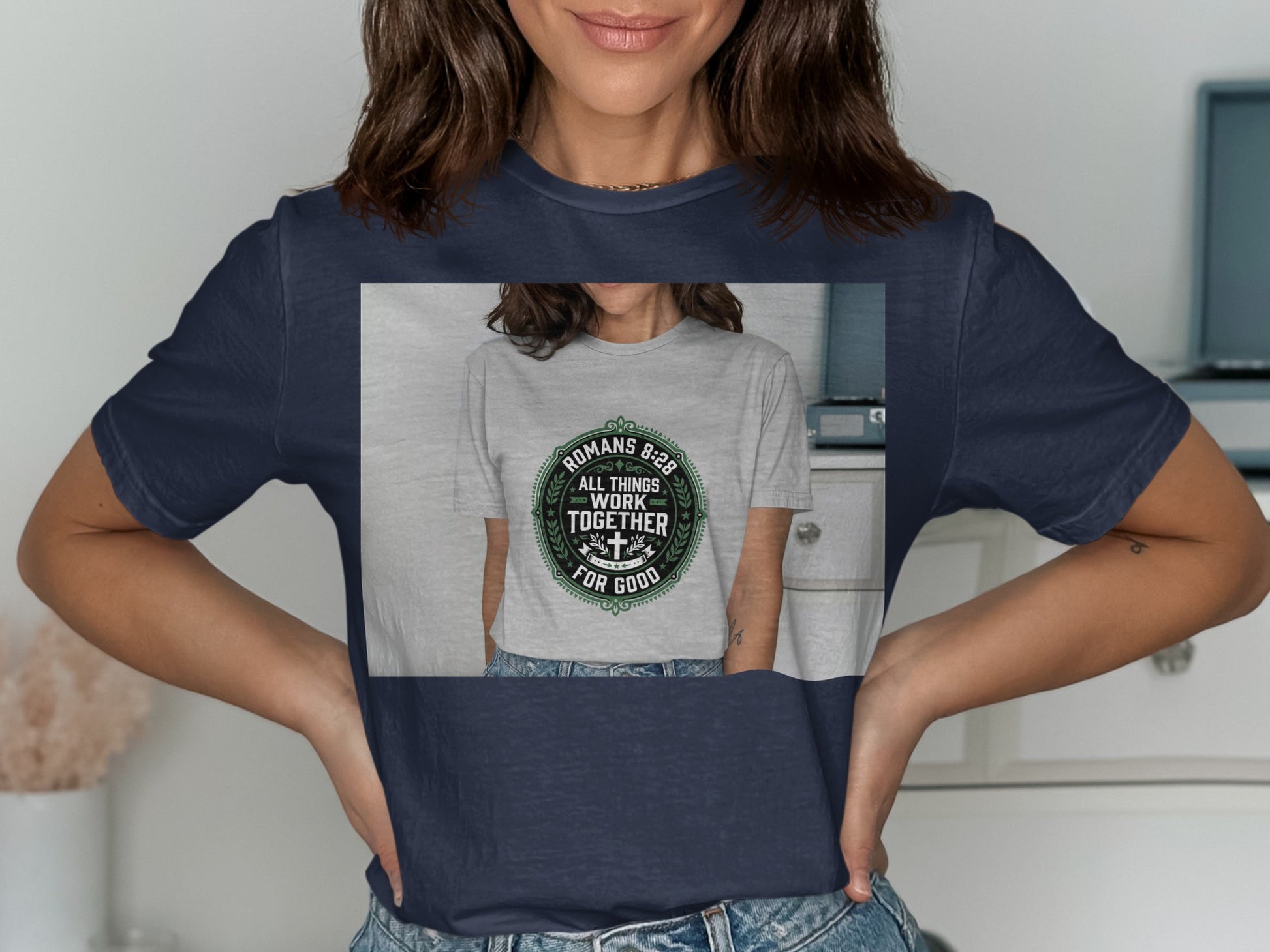 Navy t-shirt with green circular graphic featuring Romans 8:28 and a cross.