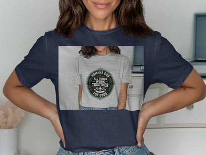 Navy t-shirt with green circular graphic featuring Romans 8:28 and a cross.