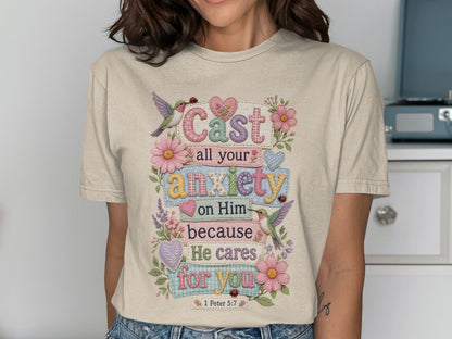 T-shirt with "Cast all your anxiety on Him because He cares for you" scripture.