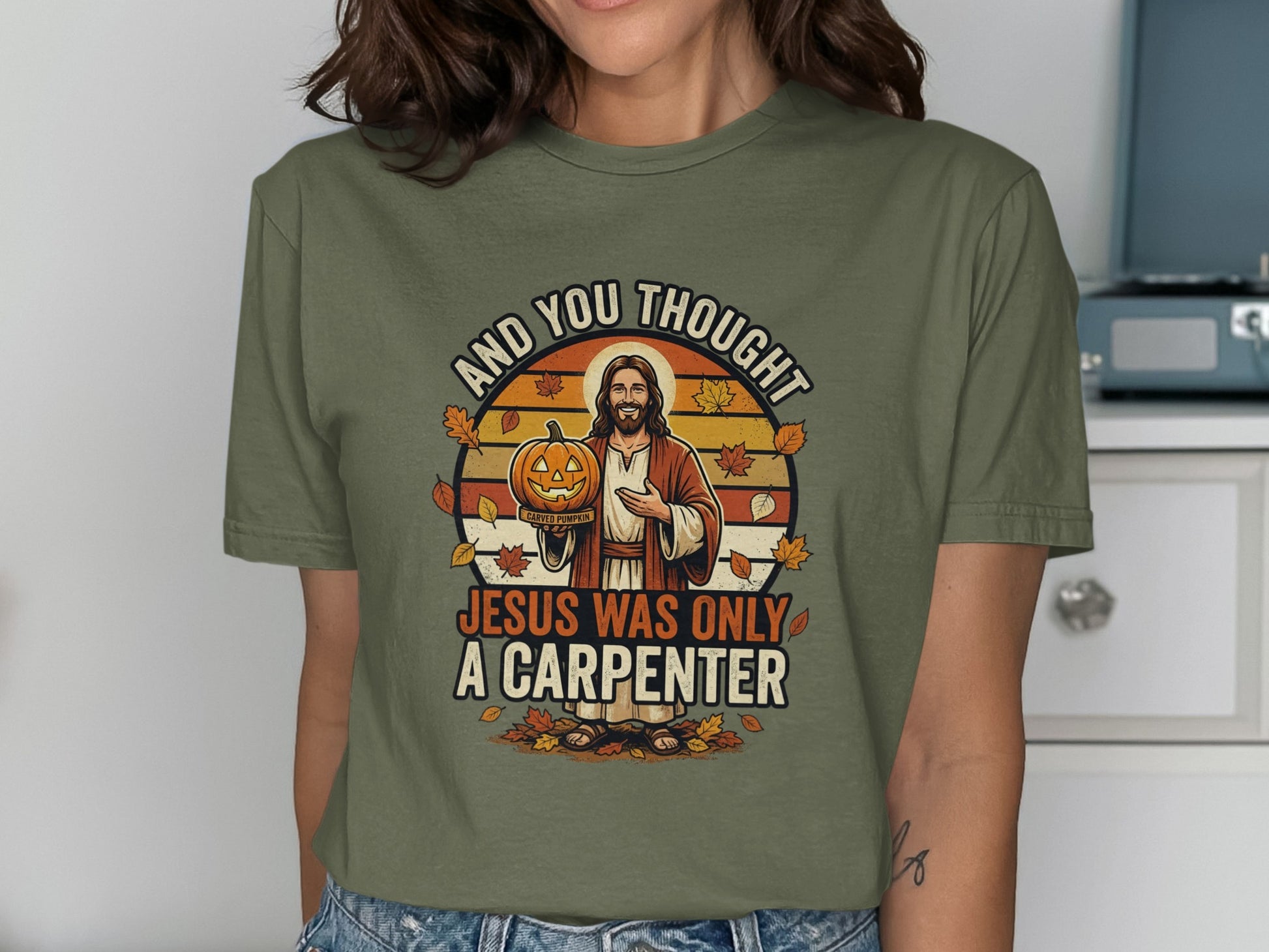 Jesus holding a pumpkin with "AND YOU THOUGHT JESUS WAS ONLY A CARPENTER" text.