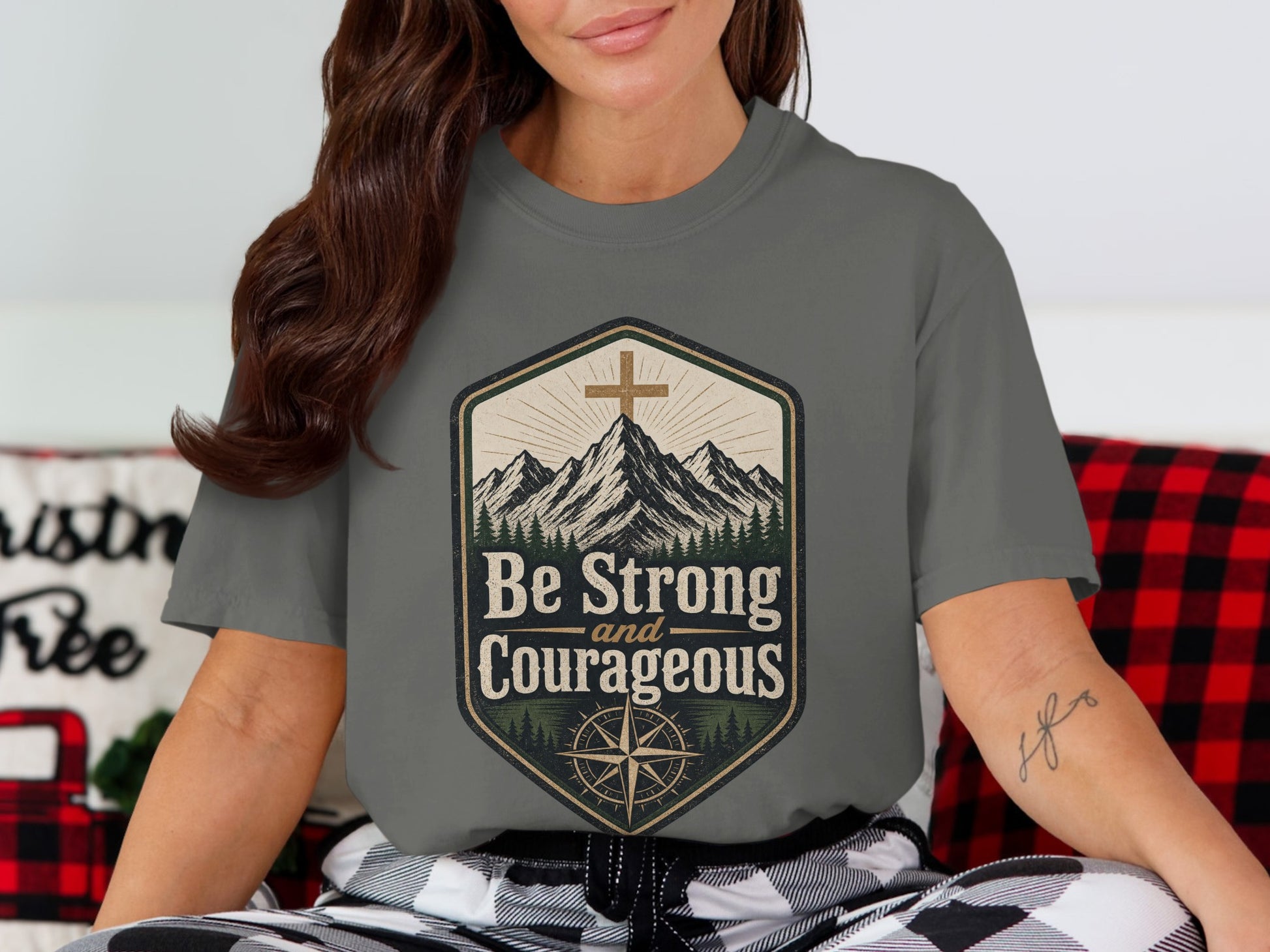 Gray t-shirt with mountains, cross, compass, and "Be Strong and Courageous" text.