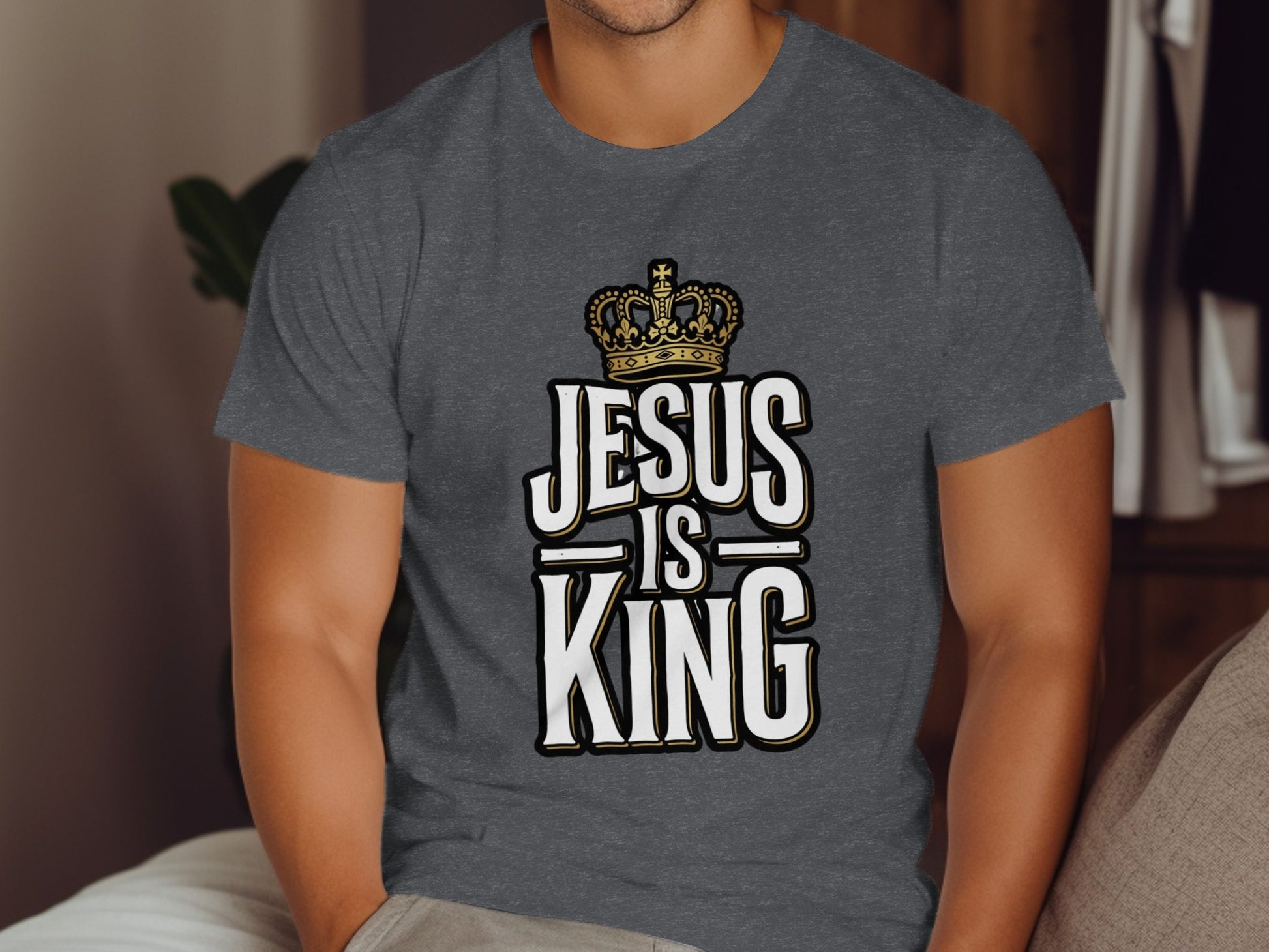 Dark grey t-shirt with "JESUS IS KING" text and a crown graphic.