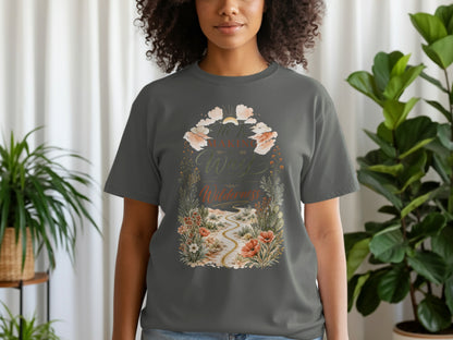 Dark gray t-shirt with graphic of a desert path amidst flowers and text "He Is Making a Way in the Wilderness".