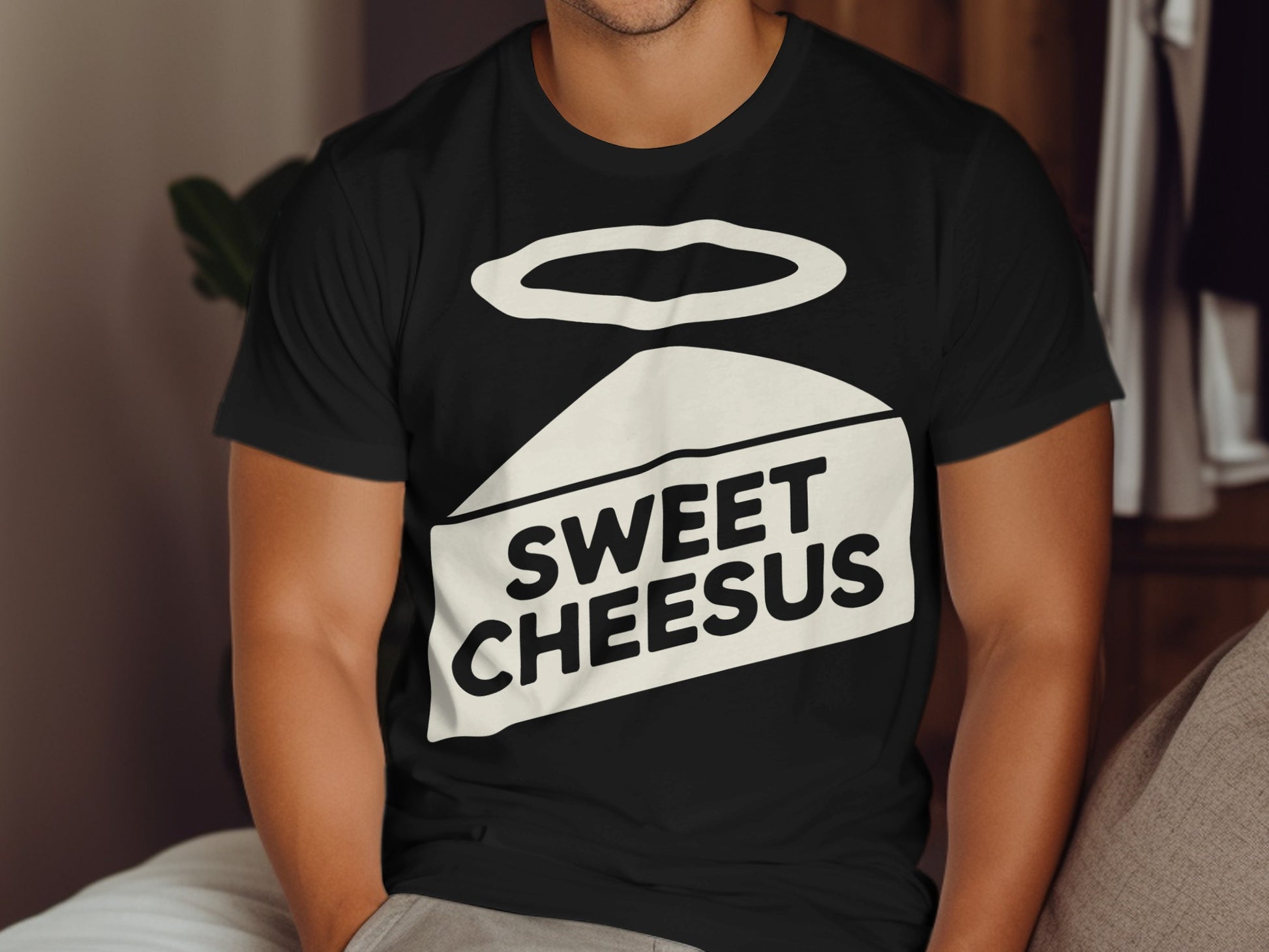 Black t-shirt with white "Sweet Cheesus" text and halo graphic.