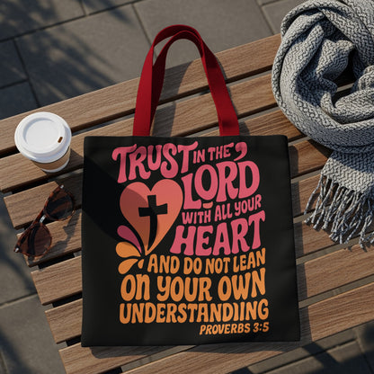 Black tote bag with text "Trust in the Lord with all your heart" and "Proverbs 3:5".