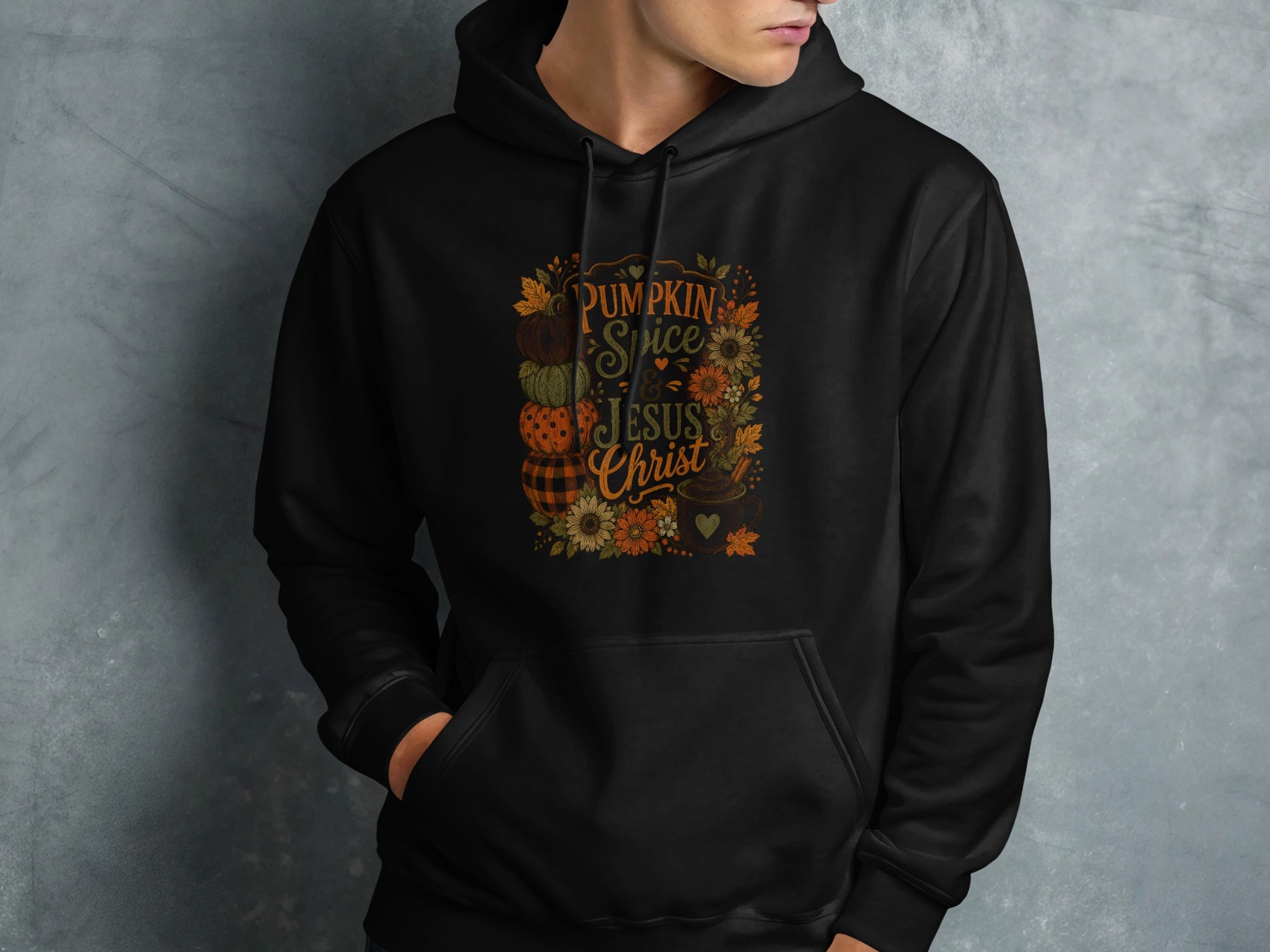 Black hoodie with "Pumpkin Spice Jesus Christ" text and fall graphic.