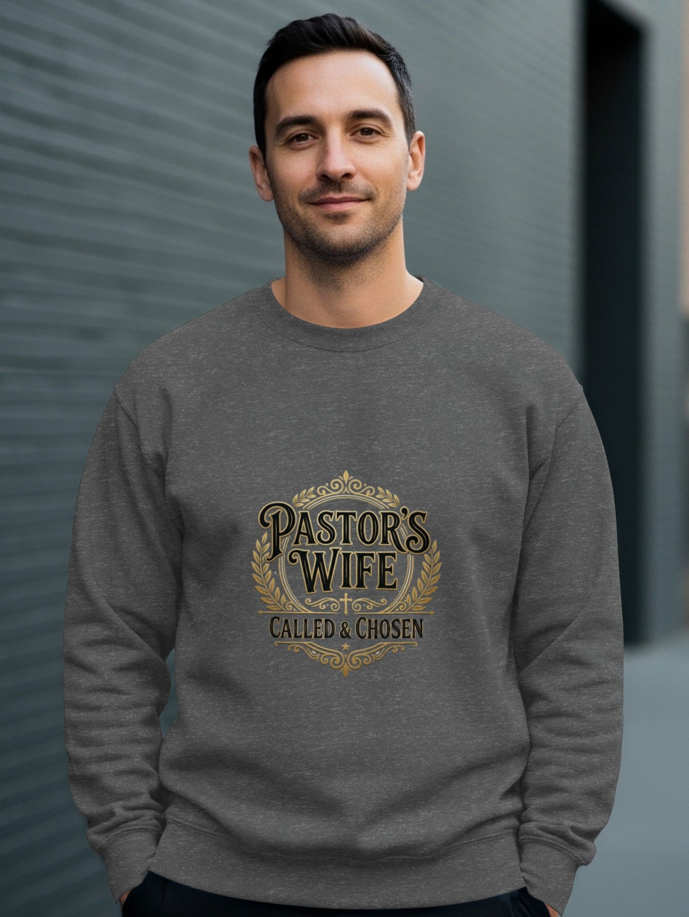 Man wearing gray sweatshirt with "Pastor's Wife Called & Chosen" text.