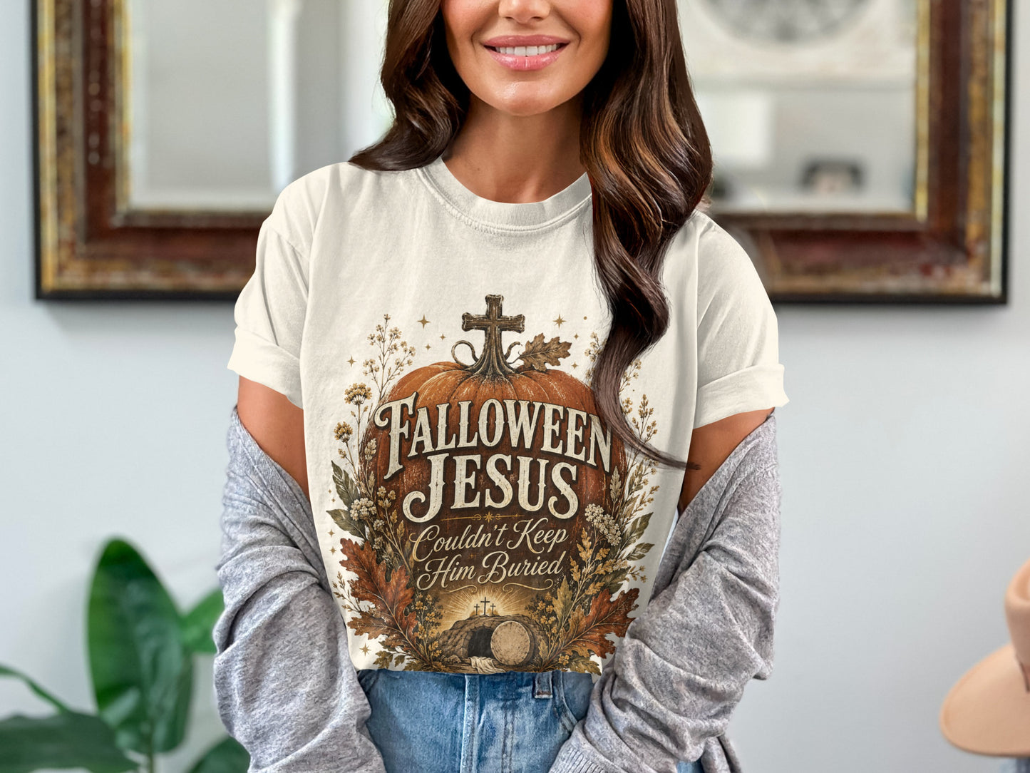 T-shirt with "Halloween Jesus Couldn't Keep Him Buried" text and a tomb graphic.