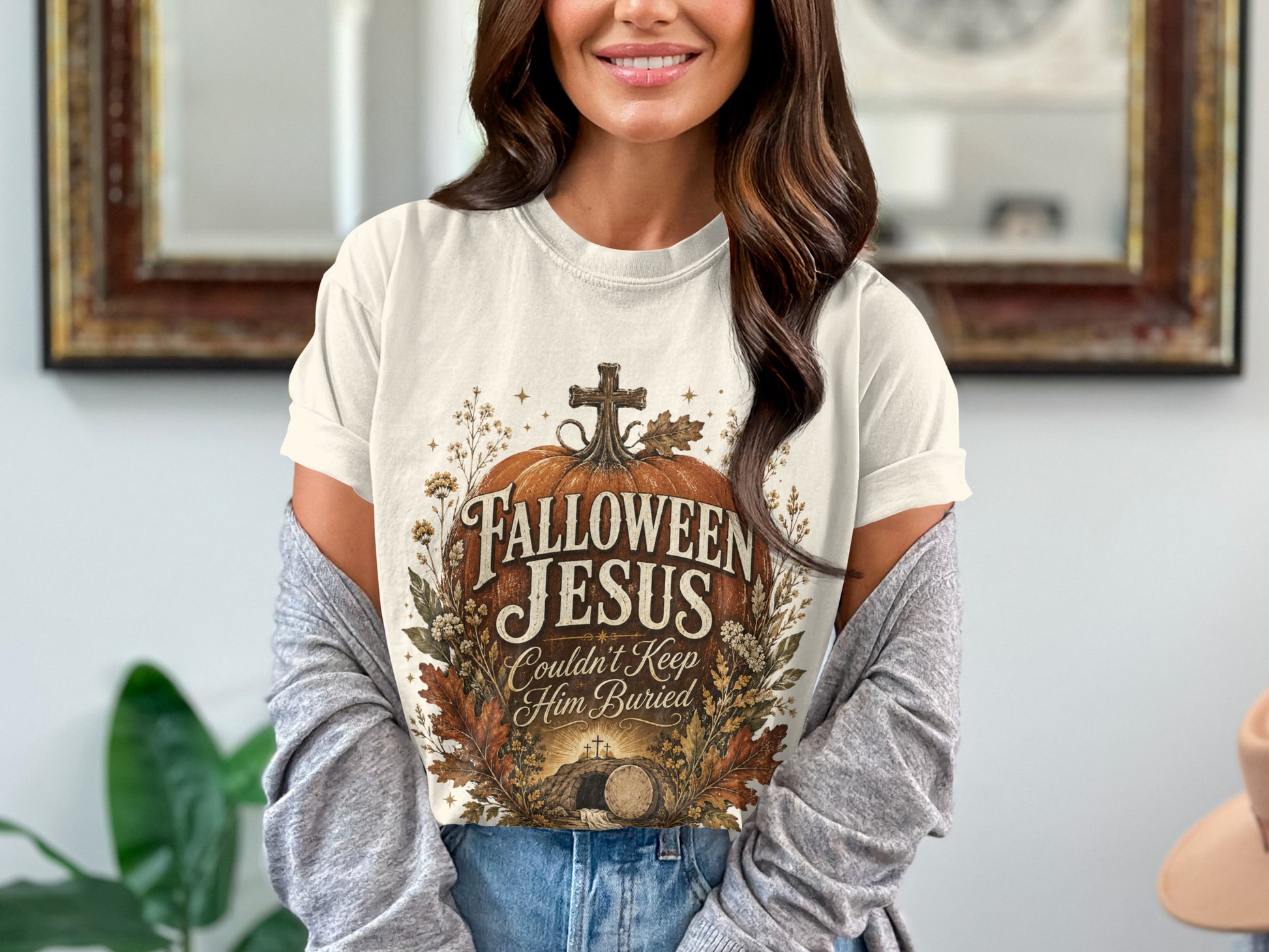 T-shirt with "Halloween Jesus Couldn't Keep Him Buried" text and a tomb graphic.
