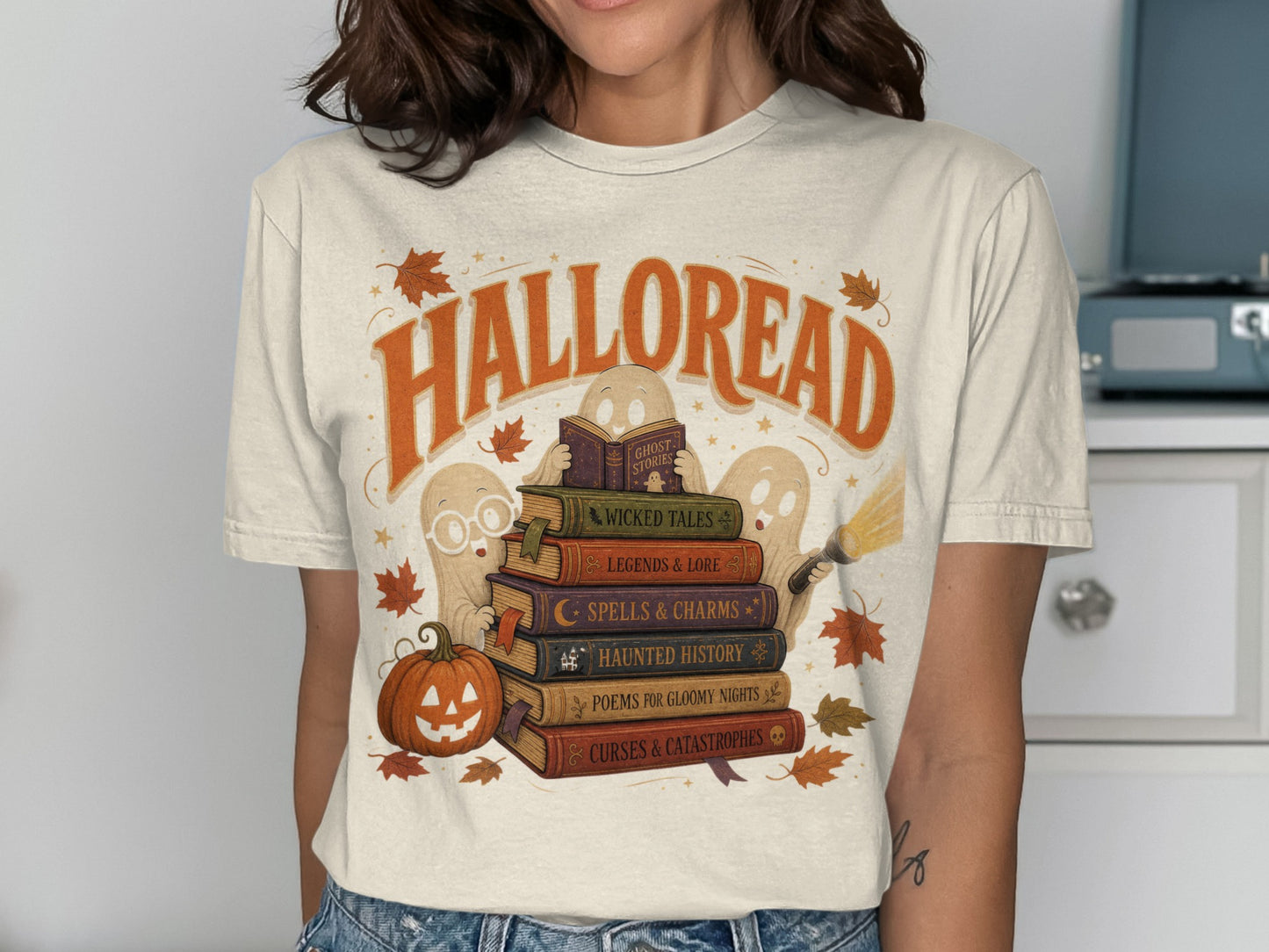 T-shirt graphic: "Halloread" text with ghosts reading spooky books and a pumpkin.