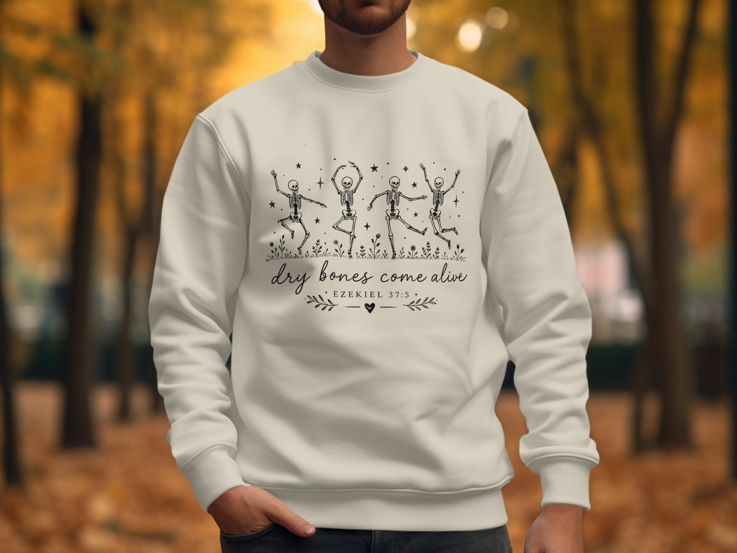 White sweatshirt with dancing skeletons and text "DRY BONES COME ALIVE".