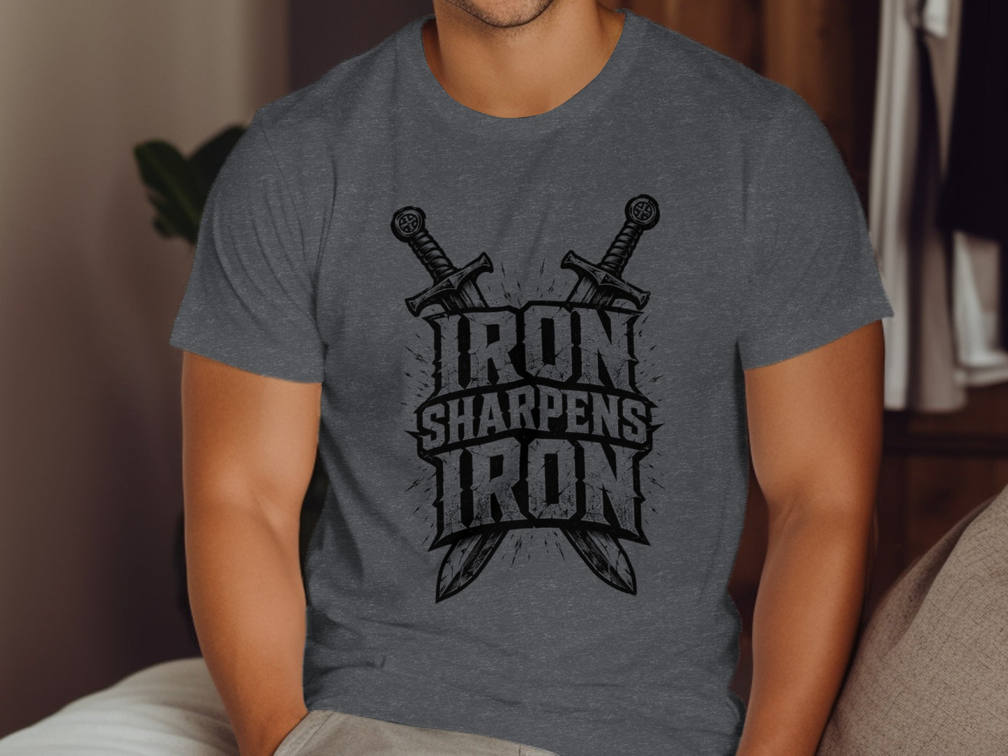 Dark gray t-shirt with "IRON SHARPENS IRON" text and crossed swords.