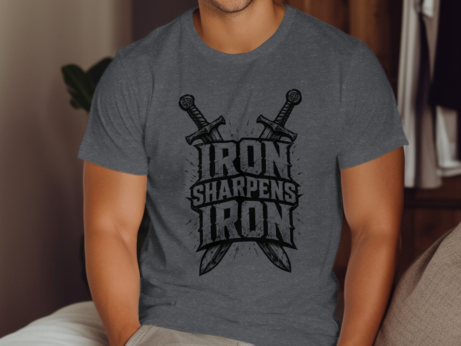 Dark gray t-shirt with "IRON SHARPENS IRON" text and crossed swords.