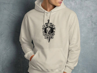 Cream hoodie with "Iron Sharpens Iron" shield and sword logo.