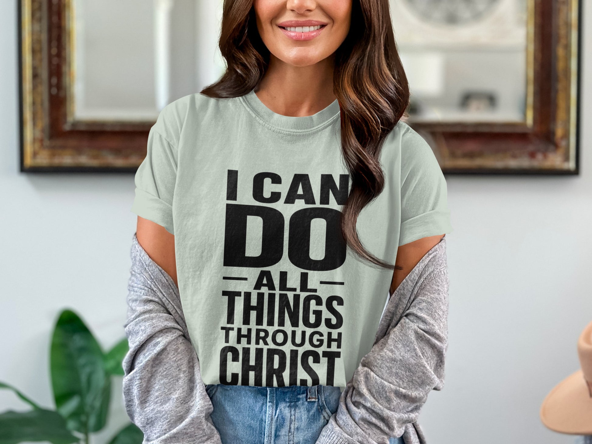 Light green t-shirt with black text that reads "I CAN DO ALL THINGS THROUGH CHRIST".