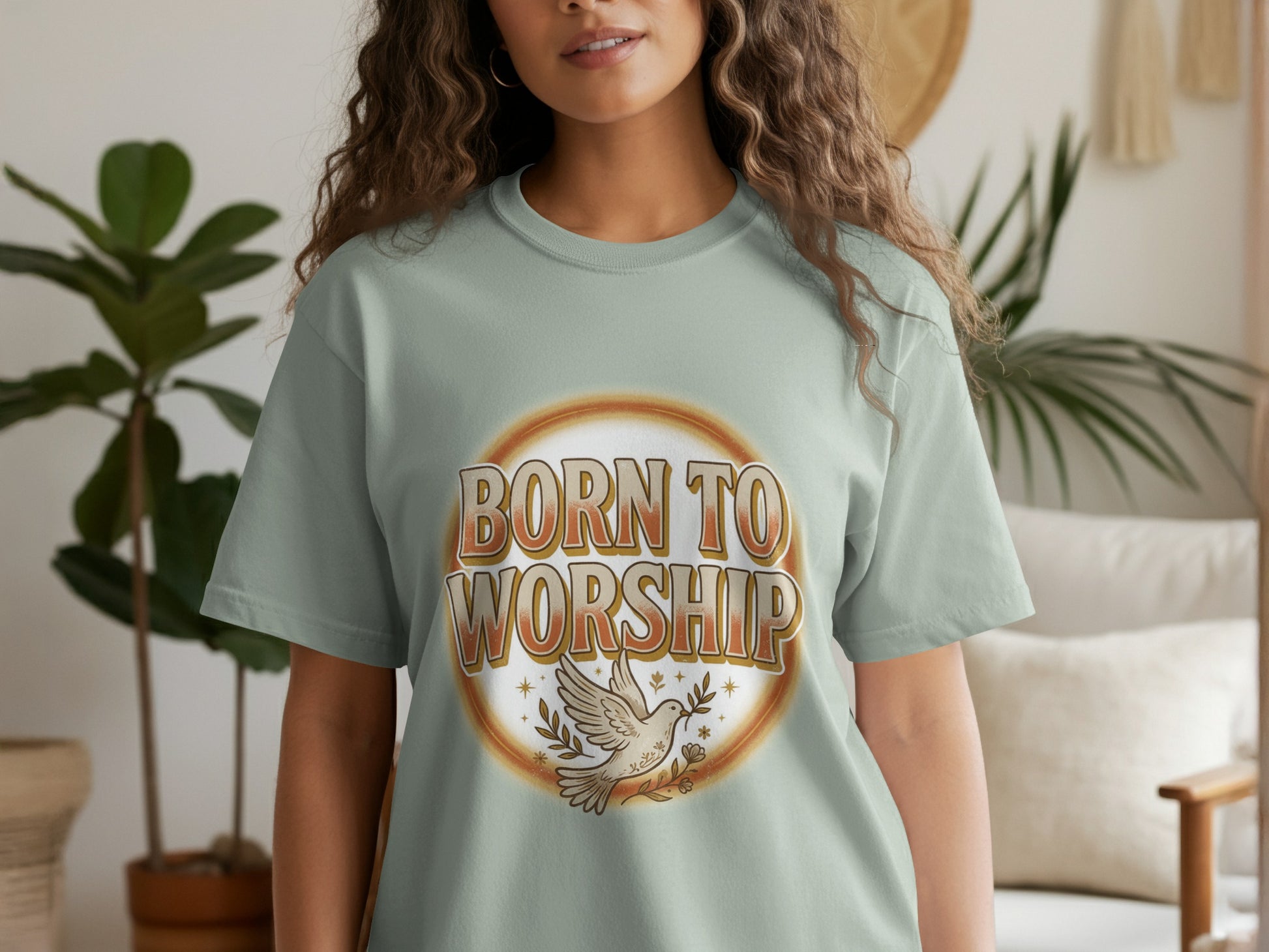 Light green t-shirt with "Born to Worship" text and dove graphic.