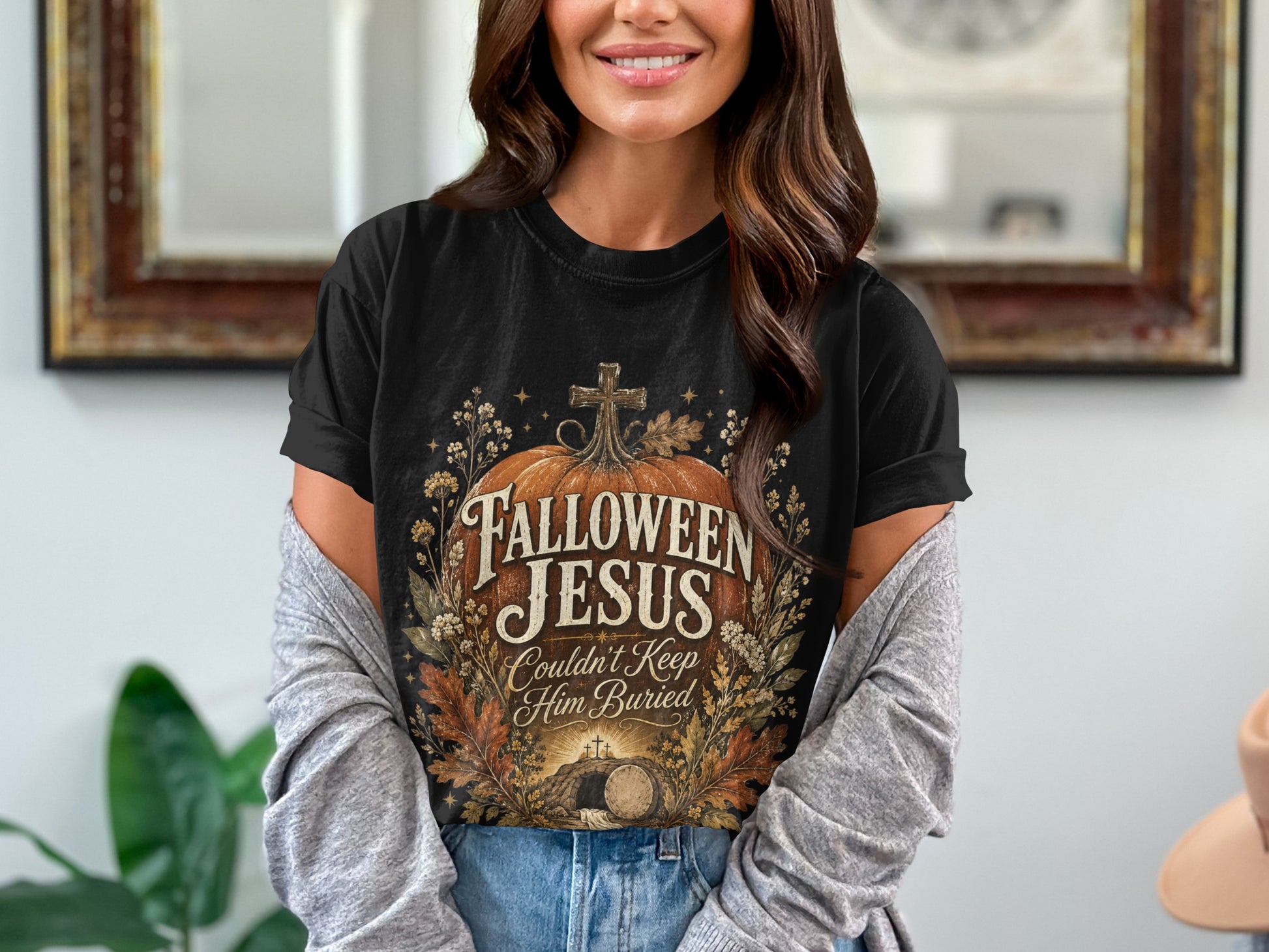 Black t-shirt with "Hallowen Jesus Couldn't Keep Him Buried" text and tomb graphic.