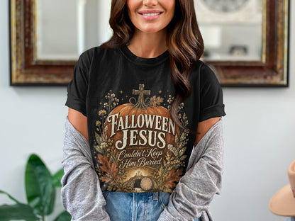 Black t-shirt with "Hallowen Jesus Couldn't Keep Him Buried" text and tomb graphic.