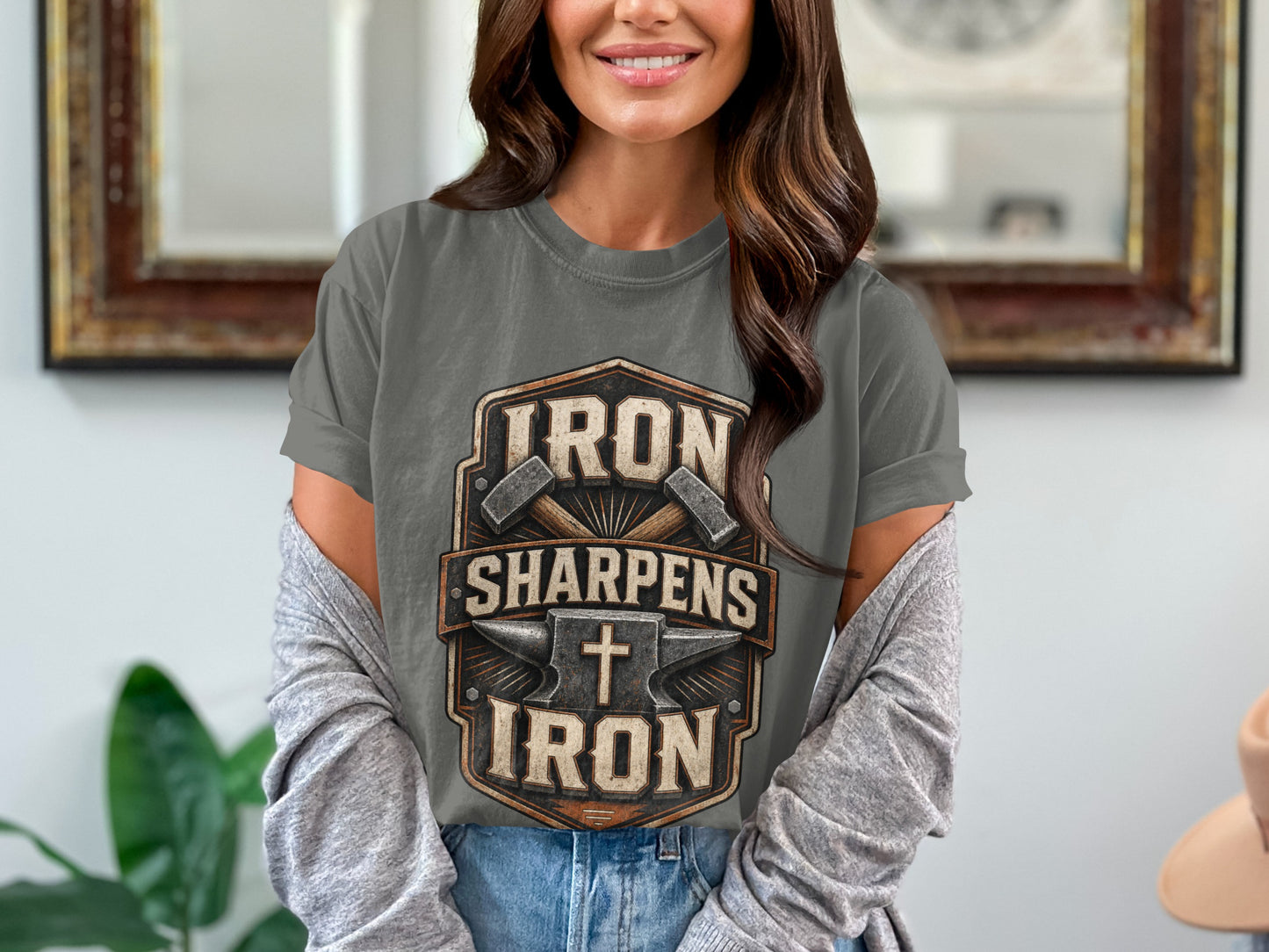 Grey t-shirt with "Iron Sharpens Iron" design featuring hammers, anvil, and cross.