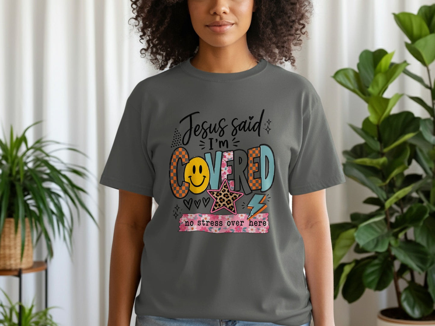 Gray t-shirt with "Jesus said I'm COVERED no stress over here" graphic