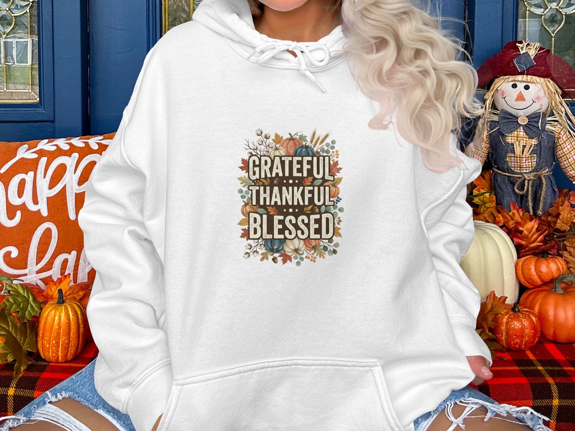 White hooded sweatshirt with "Grateful Thankful Blessed" floral autumn graphic.