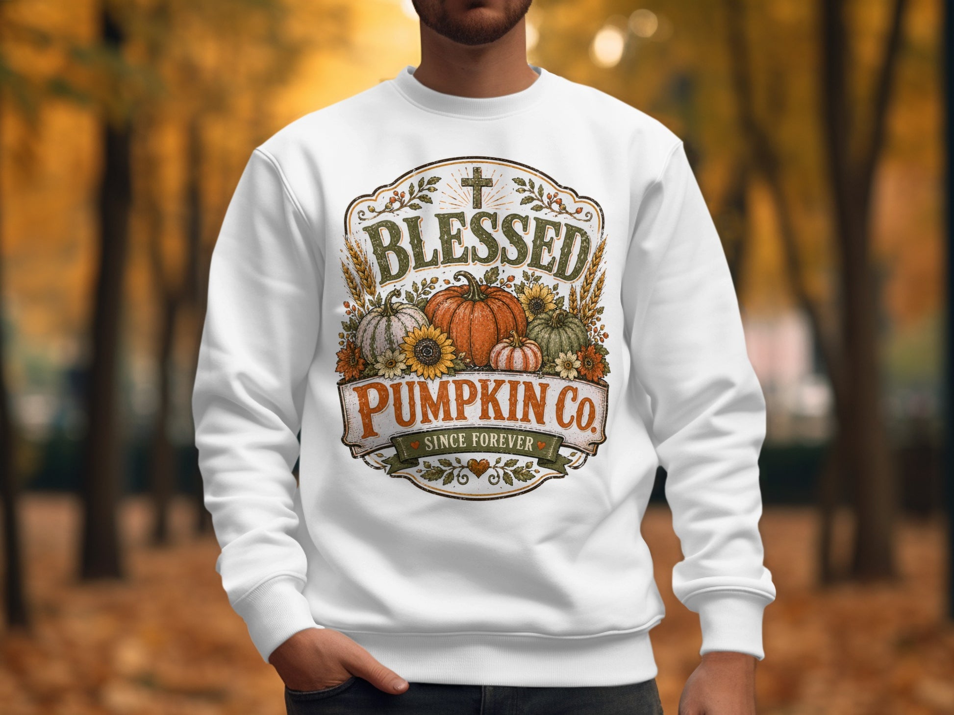 White sweatshirt with "Blessed Pumpkin Co. Since Forever" text and autumn graphics.