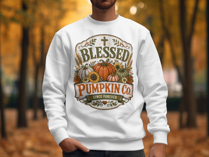 White sweatshirt with "Blessed Pumpkin Co. Since Forever" text and autumn graphics.