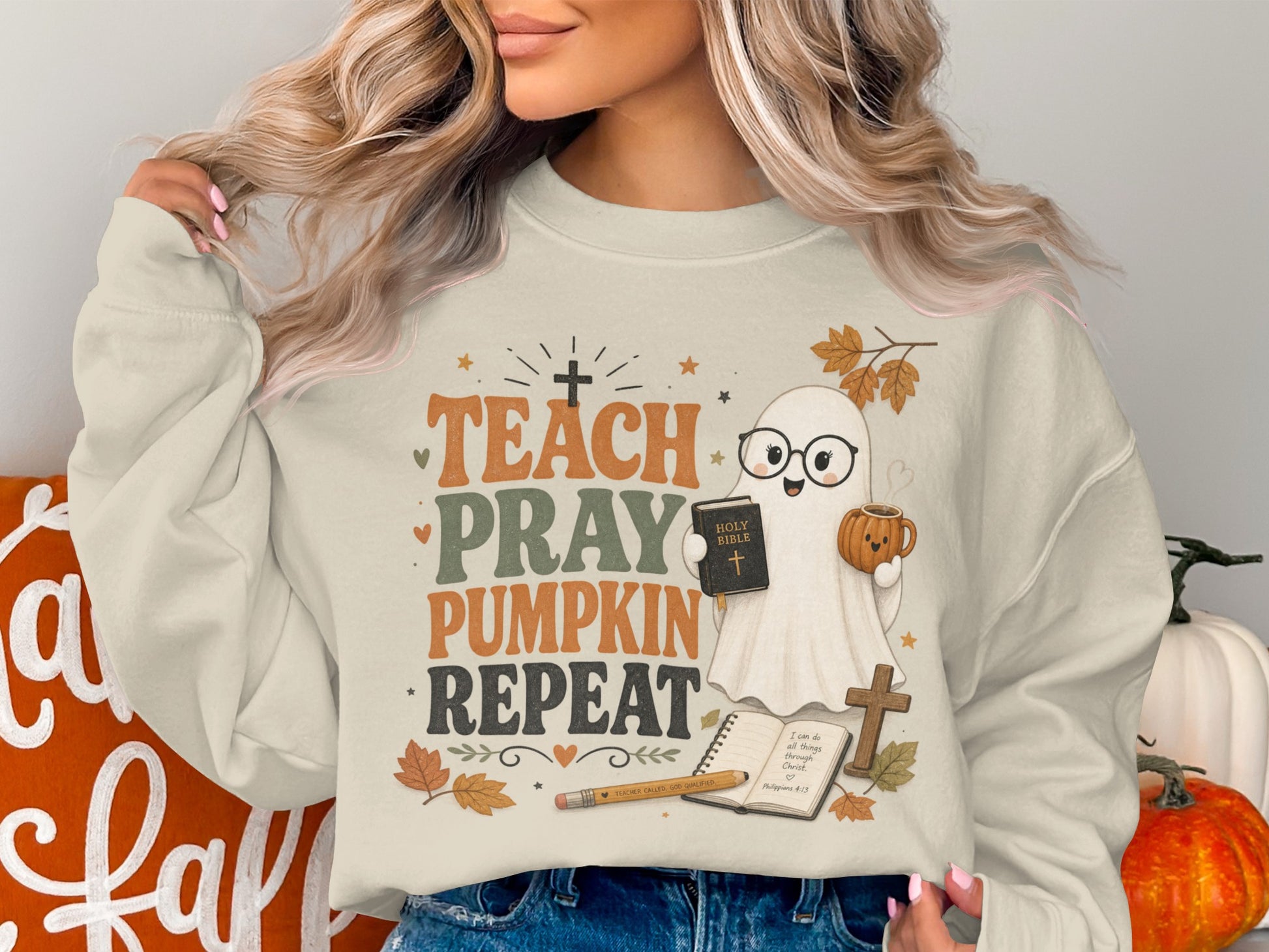Crewneck sweatshirt with text "Teach Pray Pumpkin Repeat" and cute ghost.