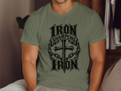 Olive green t-shirt with "Iron Sharpens Iron" and cross graphic.