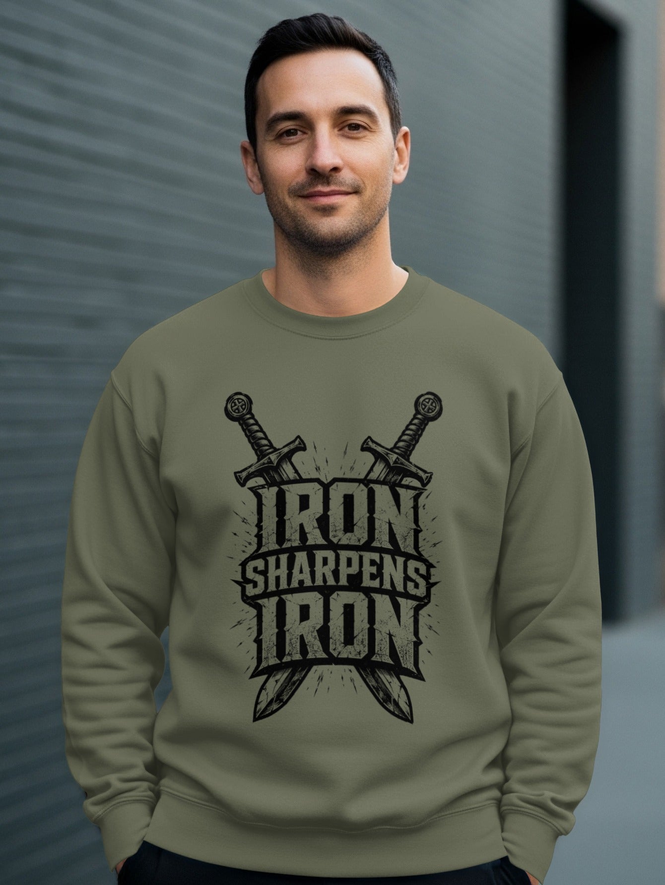 Green sweatshirt with "Iron Sharpens Iron" text and crossed swords graphic.