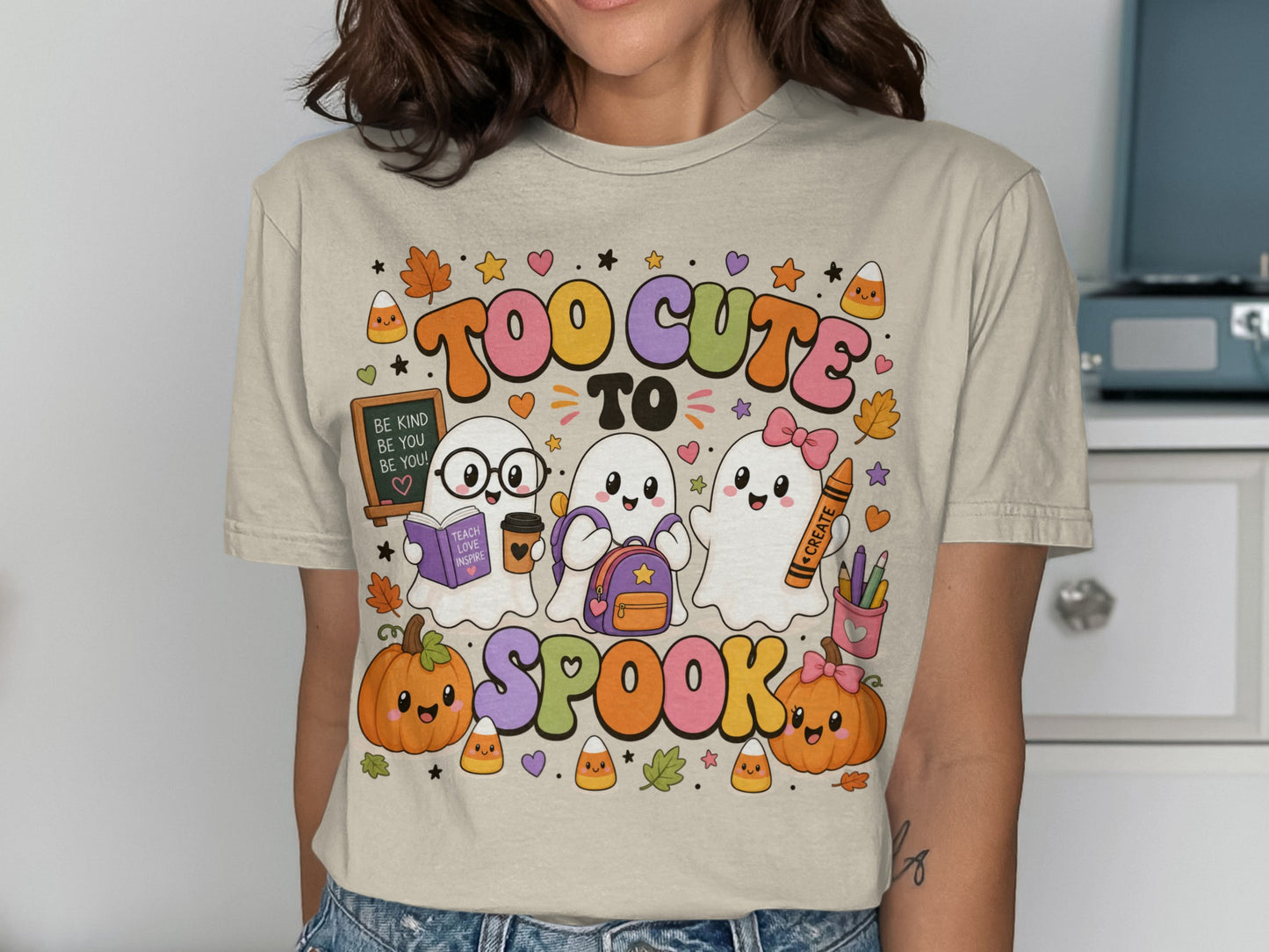 Three cute ghosts, pumpkins, and candy corn with text "TOO CUTE TO SPOOK".