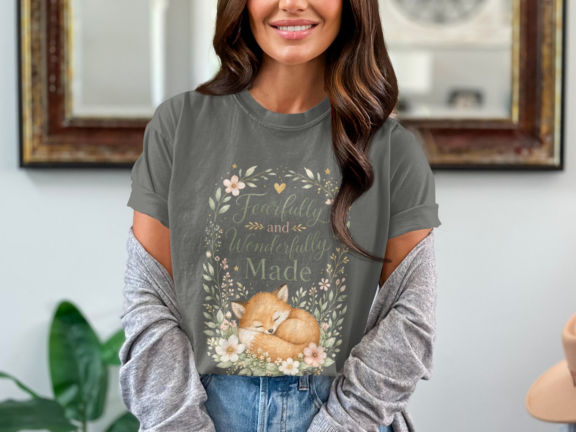 T-shirt with sleeping fox and "Fearfully and Wonderfully Made" text within floral wreath.