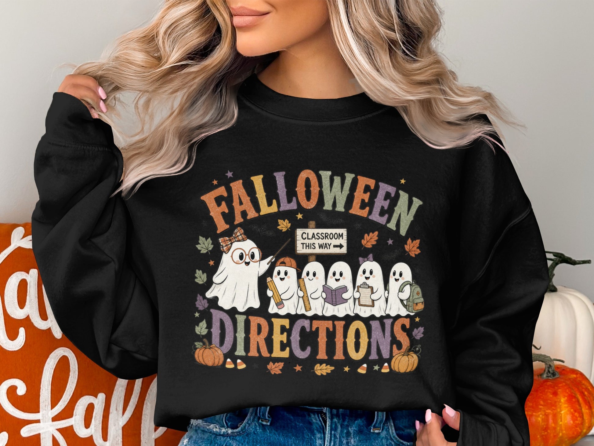Falloween Directions with ghosts, pumpkins, and a classroom sign on a black sweatshirt.