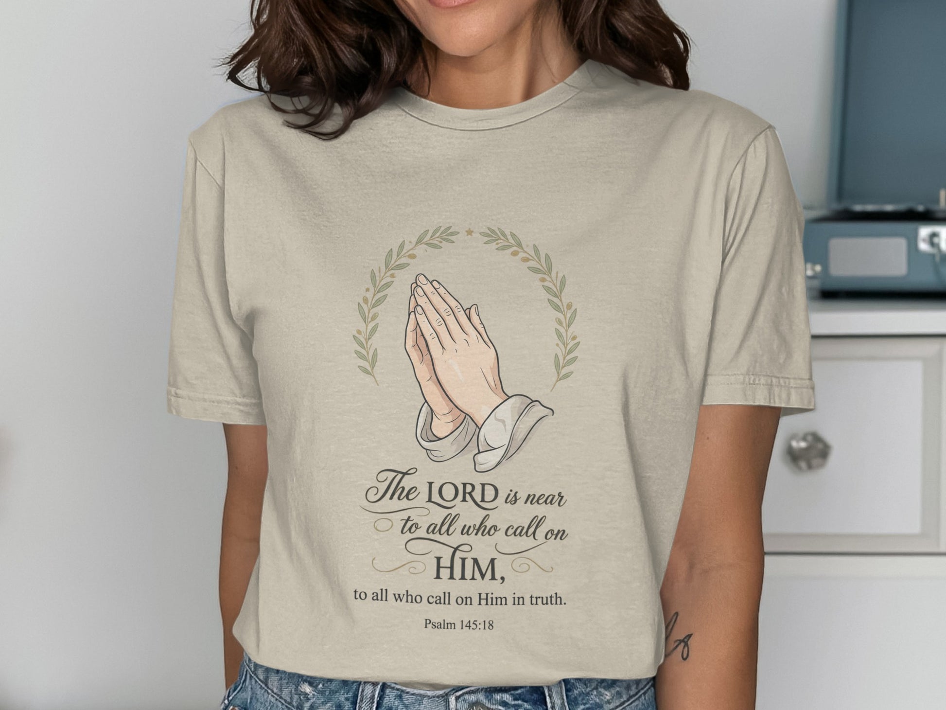 Light beige t-shirt with praying hands and Psalm 145:18 text.