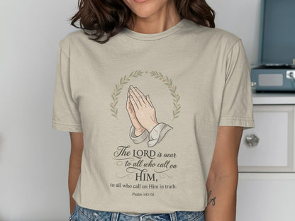 Light beige t-shirt with praying hands and Psalm 145:18 text.