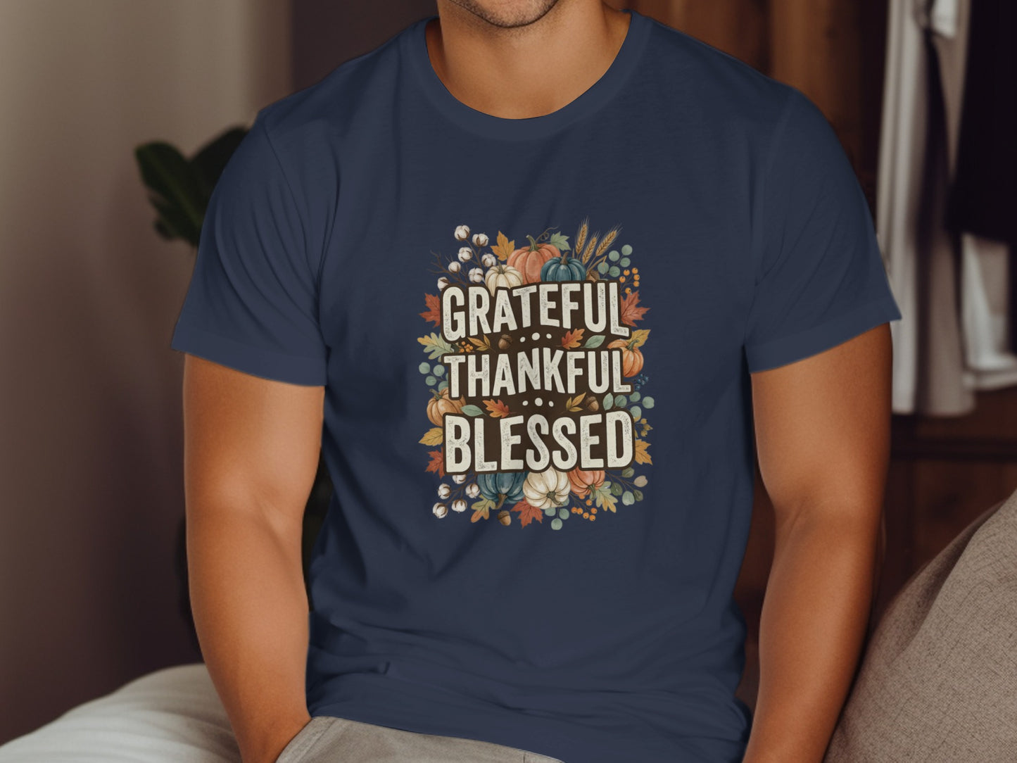 Navy t-shirt with "Grateful Thankful Blessed" text surrounded by autumn leaves and pumpkins.