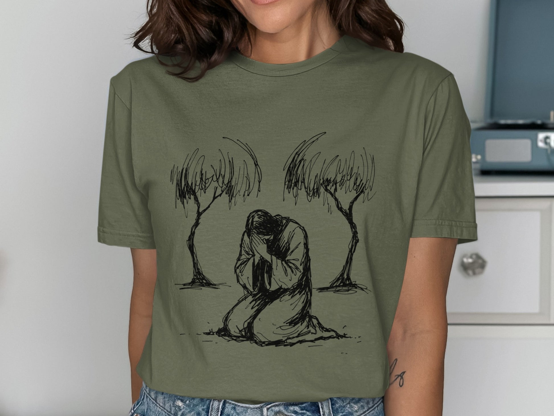 Sketch of a person kneeling between two trees.