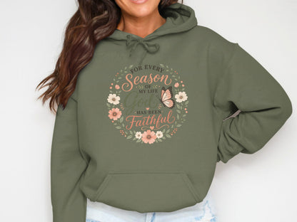 Green hoodie with floral circle and butterfly, "For Every Season of My Life God Has Been Faithful" text.
