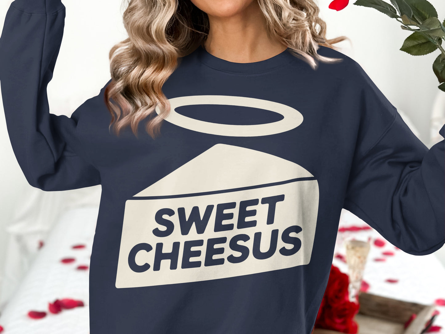 Navy sweatshirt with a "Sweet Cheesus" graphic featuring a wedge of cheese and a halo.