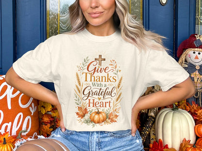 Cream t-shirt with "Give Thanks With a Grateful Heart" Thanksgiving graphic.