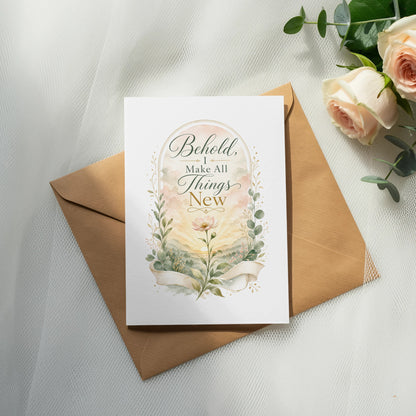 Greeting card with text "Behold, I Make All Things New" and floral design.
