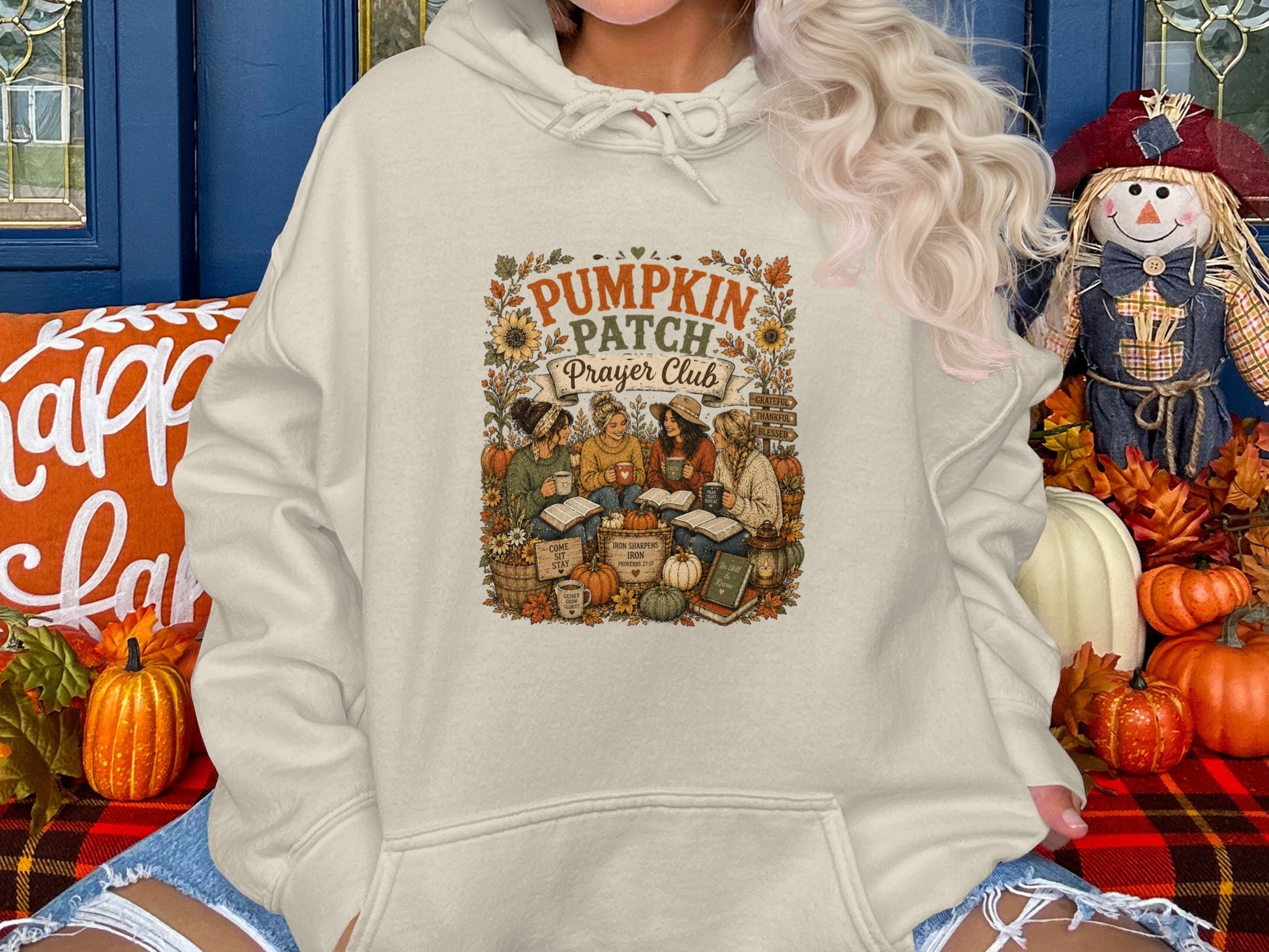 Cream sweatshirt with "Pumpkin Patch Prayer Club" graphic, featuring autumn imagery.