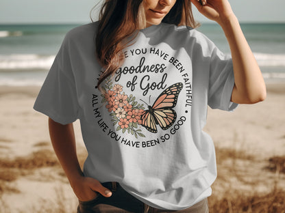 Light gray t-shirt with butterfly and floral design, and text "goodness of God".