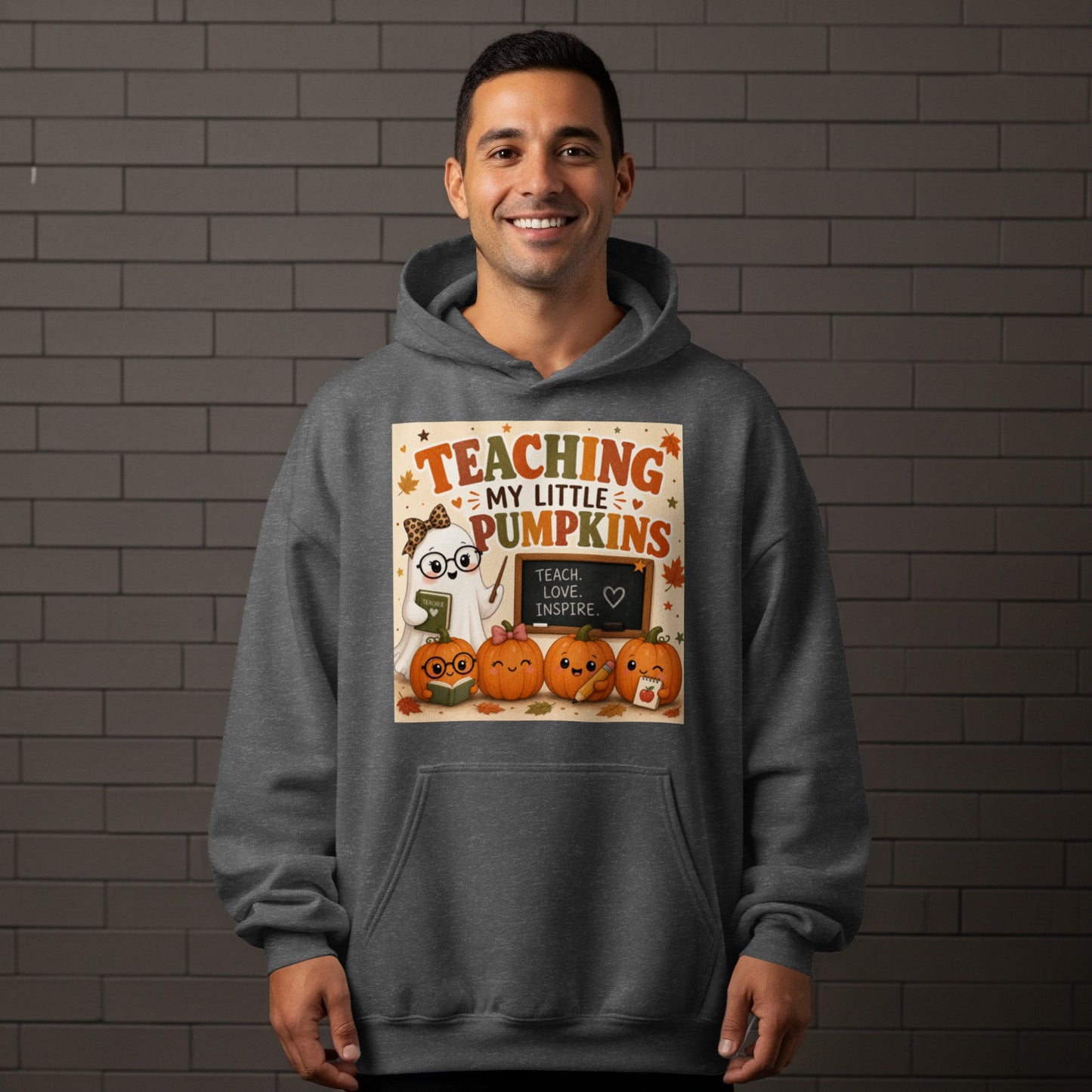 "Teaching my little pumpkins" graphic with ghost teacher and pumpkins on dark grey hoodie.