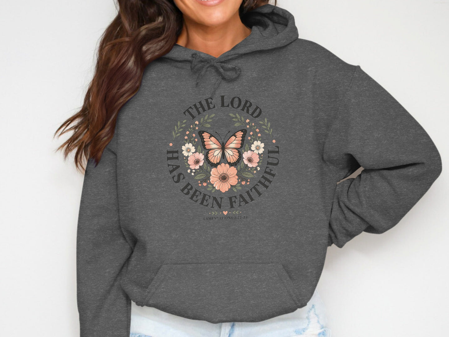 Dark grey hoodie with "The Lord Has Been Faithful" floral butterfly design.
