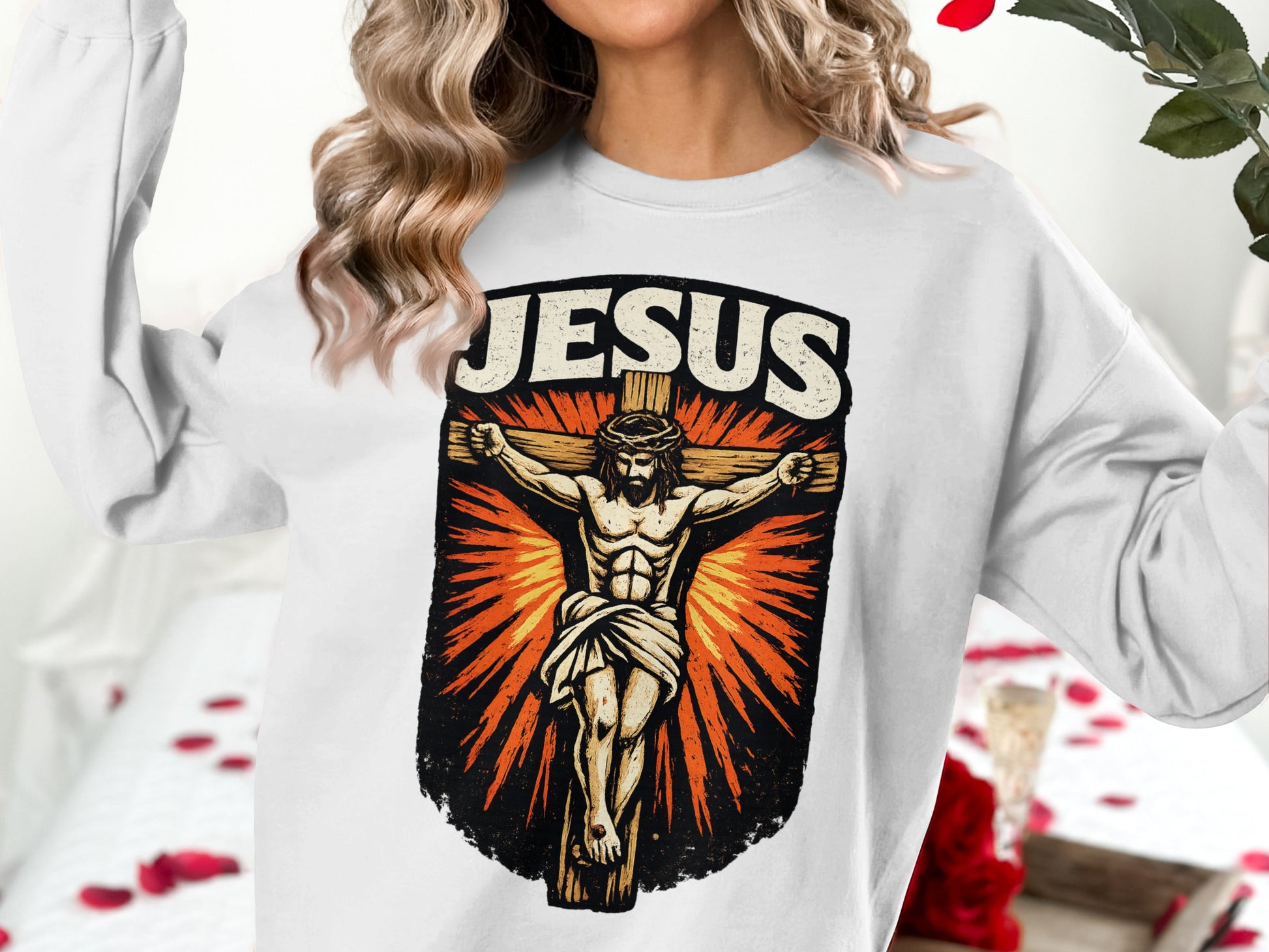 Jesus Christ crucified on the cross graphic on white crewneck sweatshirt.