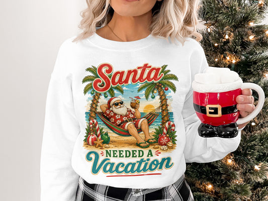 Woman wearing a sweatshirt with Santa on vacation in a hammock.