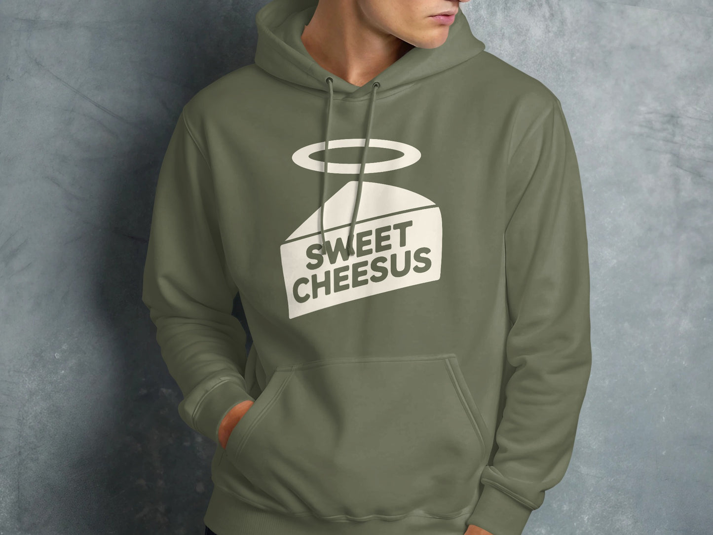 Green hoodie with "Sweet Cheesus" text and halo graphic on a slice of cheese.